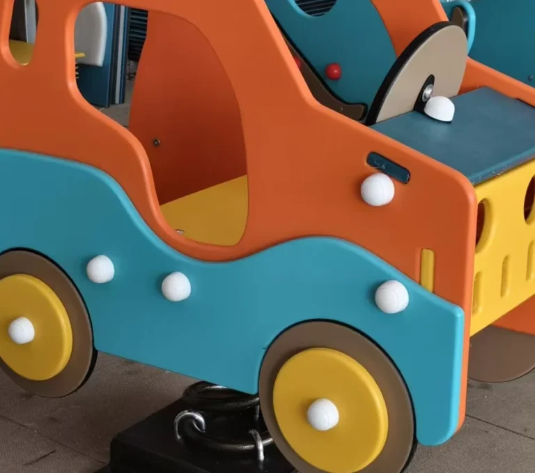 Playground Equipment Manufacturer | Indoor Soft Play & Custom Outdoor Playgrounds | Xinjiu Close-up of shaped orange and blue PE play panels and fasteners