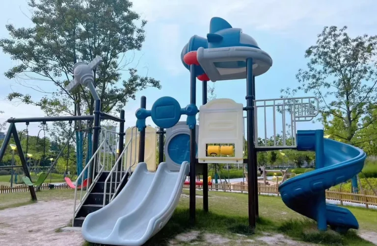 Playground Equipment Manufacturer | Indoor Soft Play & Custom Outdoor Playgrounds | Xinjiu Blue play tower with an open double slide and a spiral slide