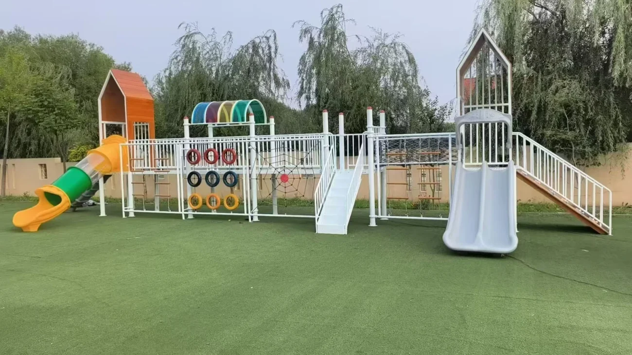 Contemporary park playground with house-shaped towers, slides and climbing activities