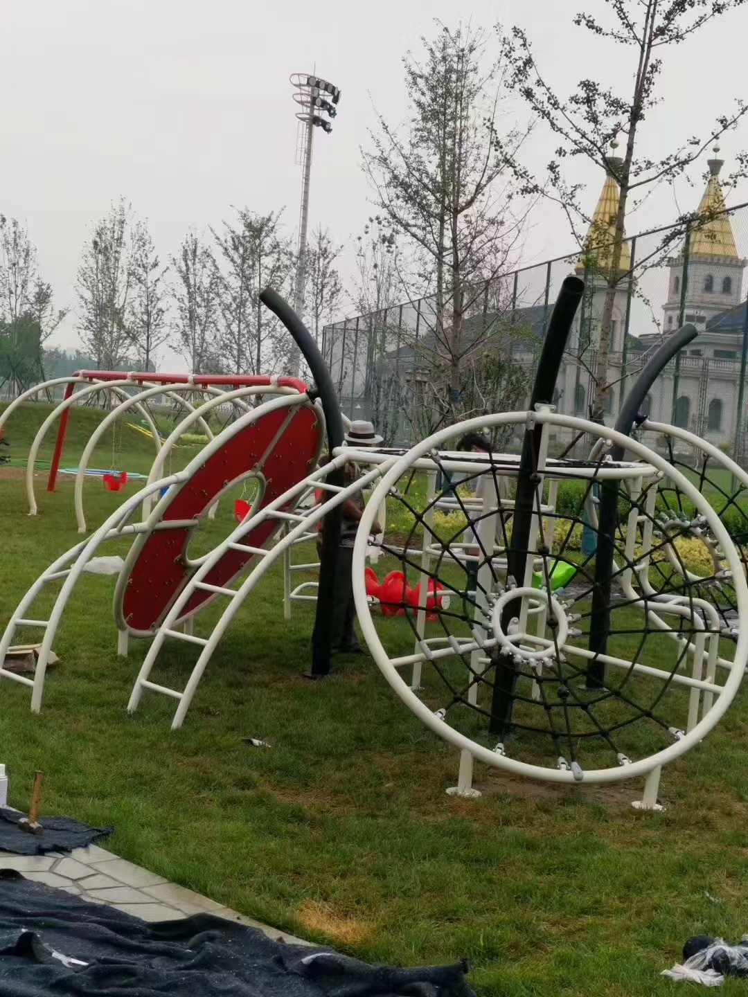 Park Playground Equipment Supplier: Planning Community and Destination Play Spaces Circular net climbing system for an open park climbing destination