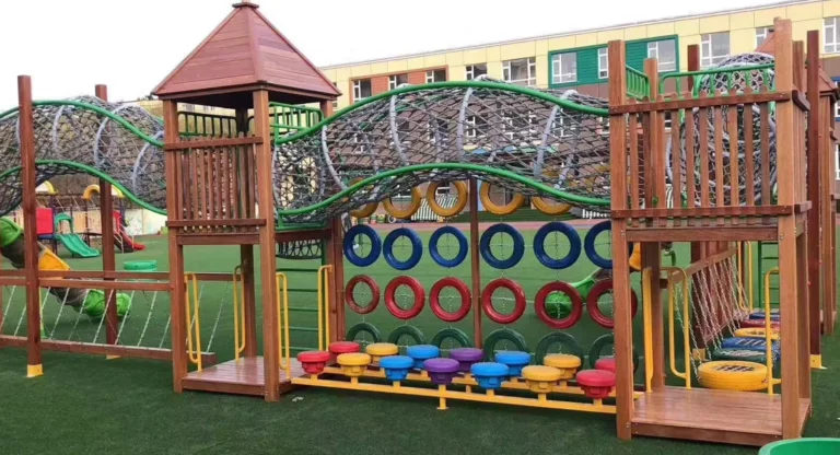 03关于我们页-About Wenzhou Xinjiu Amusement | Custom Playground Manufacturer Wood-look playground structure with rope climbing activities